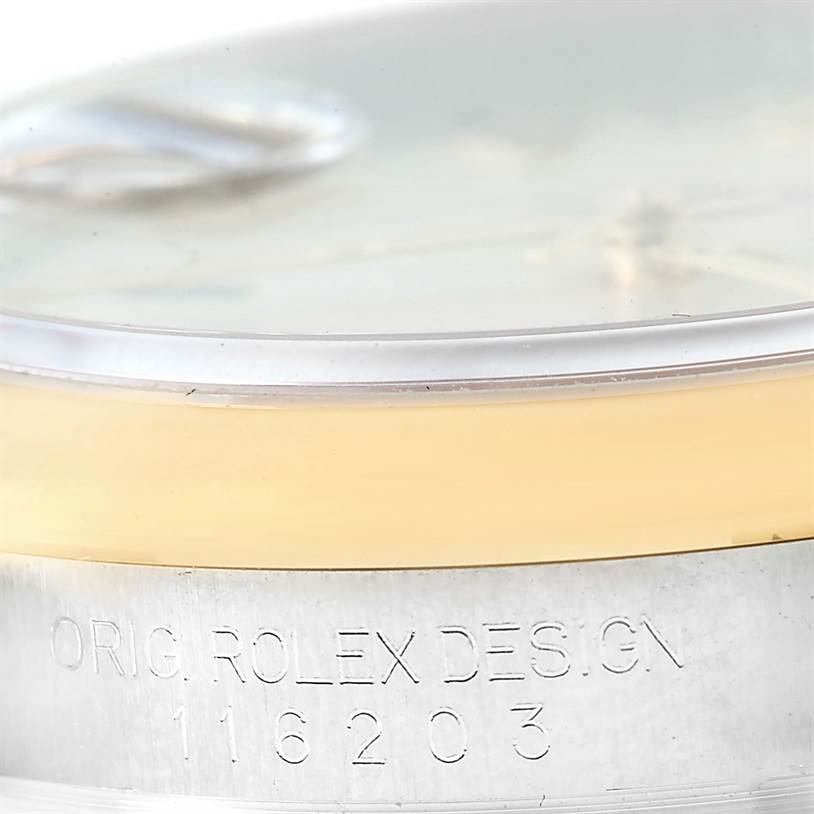 The image shows a close-up angle of the serial number and bezel of the Rolex Datejust 116203 Men's Stainless Steel Beige Dial 116203 Men's Stainless Steel Beige Dial watch.