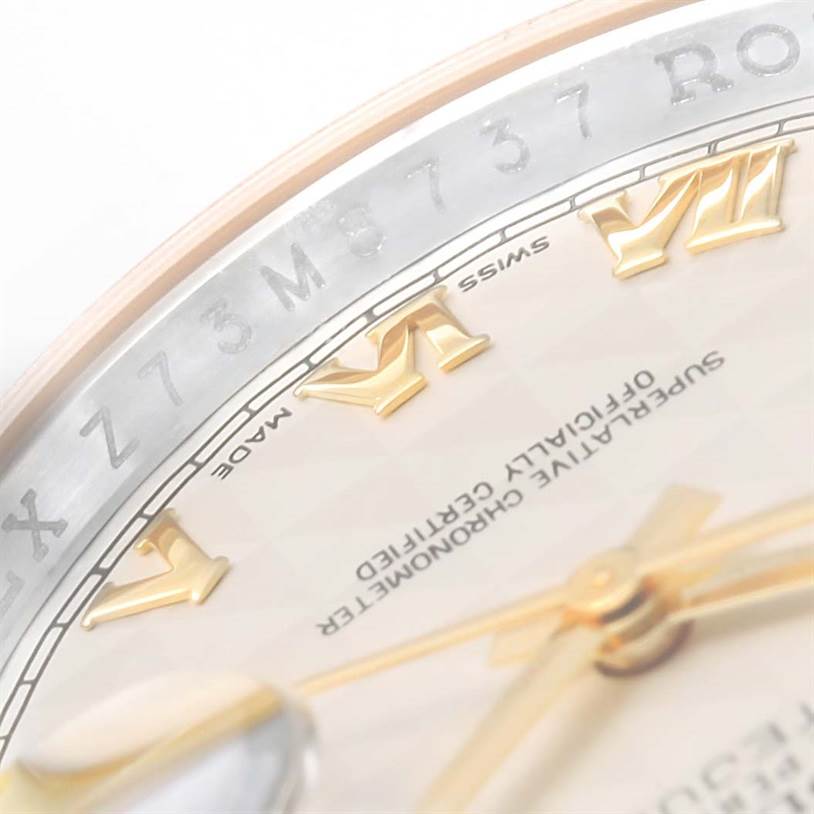 The image shows a close-up of the dial and inner bezel of the Rolex Datejust 116203 Men's Stainless Steel Beige Dial 116203 Men's Stainless Steel Beige Dial, highlighting the Roman numerals and some text.