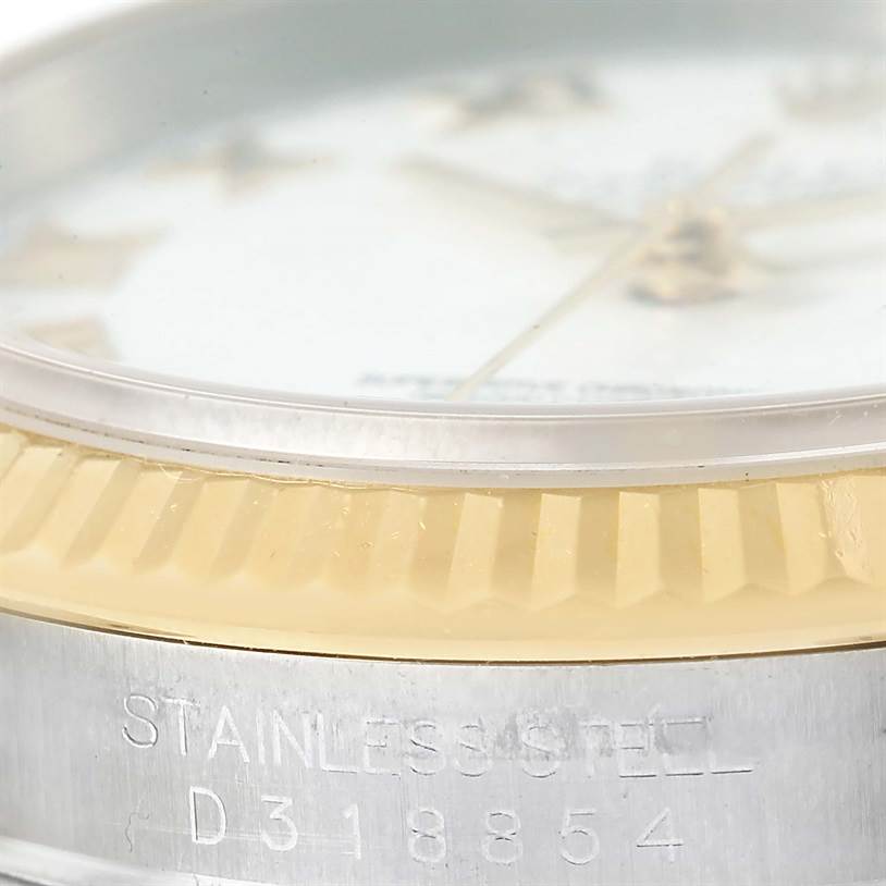 This close-up angle shows the bezel and a partial view of the dial and case of a Rolex Datejust 116233 Men's Stainless Steel White Dial 116233 Men's Stainless Steel White Dial watch.