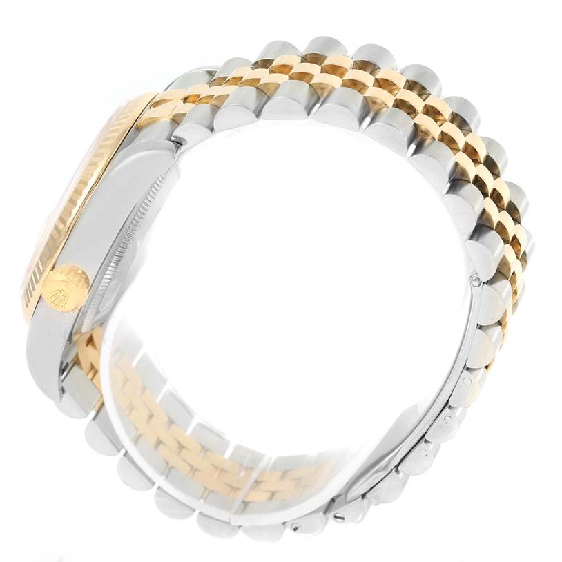 The image shows the side view of a Rolex Datejust 116233 Men's Stainless Steel White Dial 116233 Men's Stainless Steel White Dial watch, specifically focusing on the two-tone bracelet and the crown.