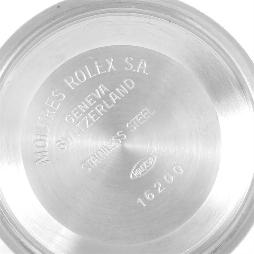 This is the back case of a Rolex Datejust 16233 Men's Steel and Gold (two tone) Black Dial 16233 Men's Steel and Gold (two tone) Black Dial watch, showing the model number and brand engraving.