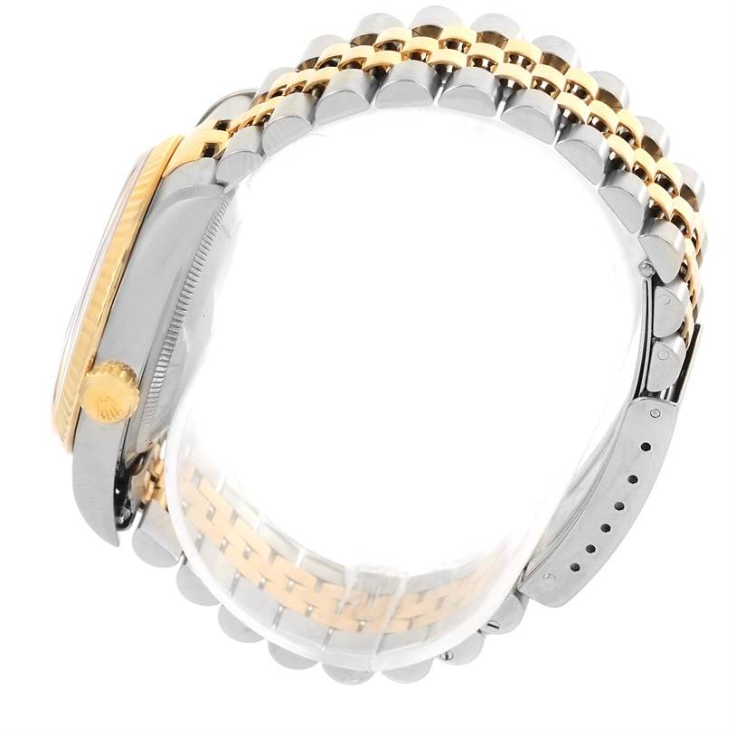 The image shows a side view of a Rolex Datejust 16233 Men's Steel and Gold (two tone) Black Dial 16233 Men's Steel and Gold (two tone) Black Dial watch, highlighting its two-tone bracelet and crown.