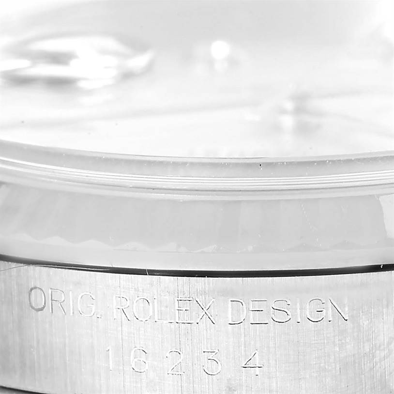 This close-up angle shows the engraving on the side of the case of a Rolex Datejust 16234 Men's Stainless Steel Silver Dial 16234 Men's Stainless Steel Silver Dial model watch, specifically the model number 16234.