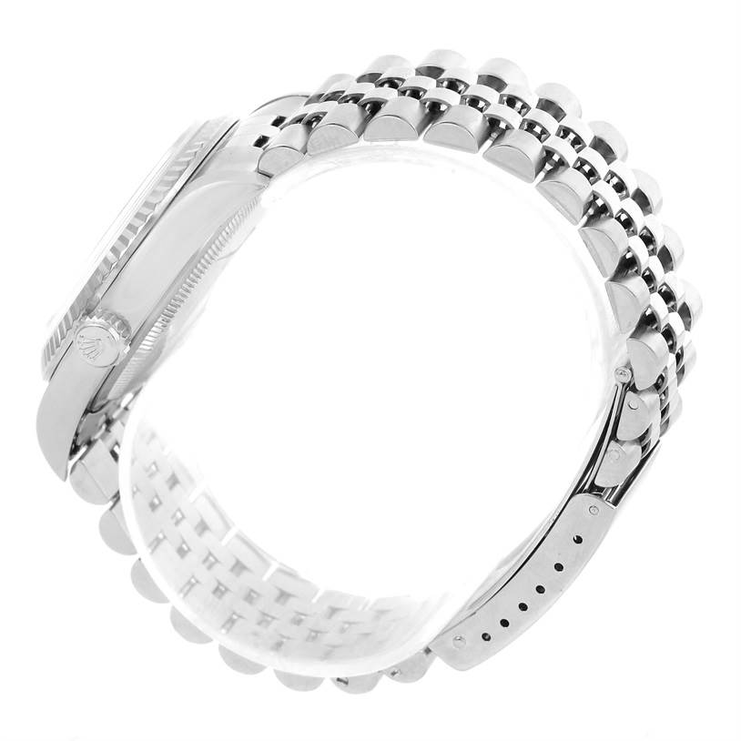 The image shows a side view of the Rolex Datejust 16234 Men's Stainless Steel Silver Dial 16234 Men's Stainless Steel Silver Dial watch, highlighting the case, crown, and bracelet.