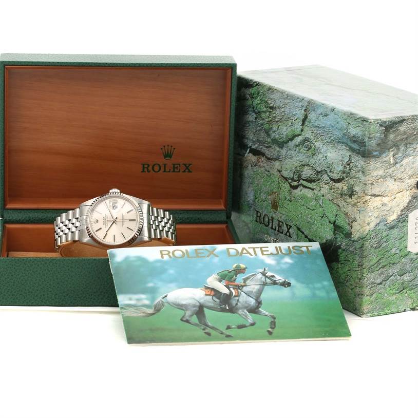 The image shows a Rolex Datejust 16234 Men's Stainless Steel Silver Dial 16234 Men's Stainless Steel Silver Dial watch in its open box with an accompanying booklet and outer packaging.
