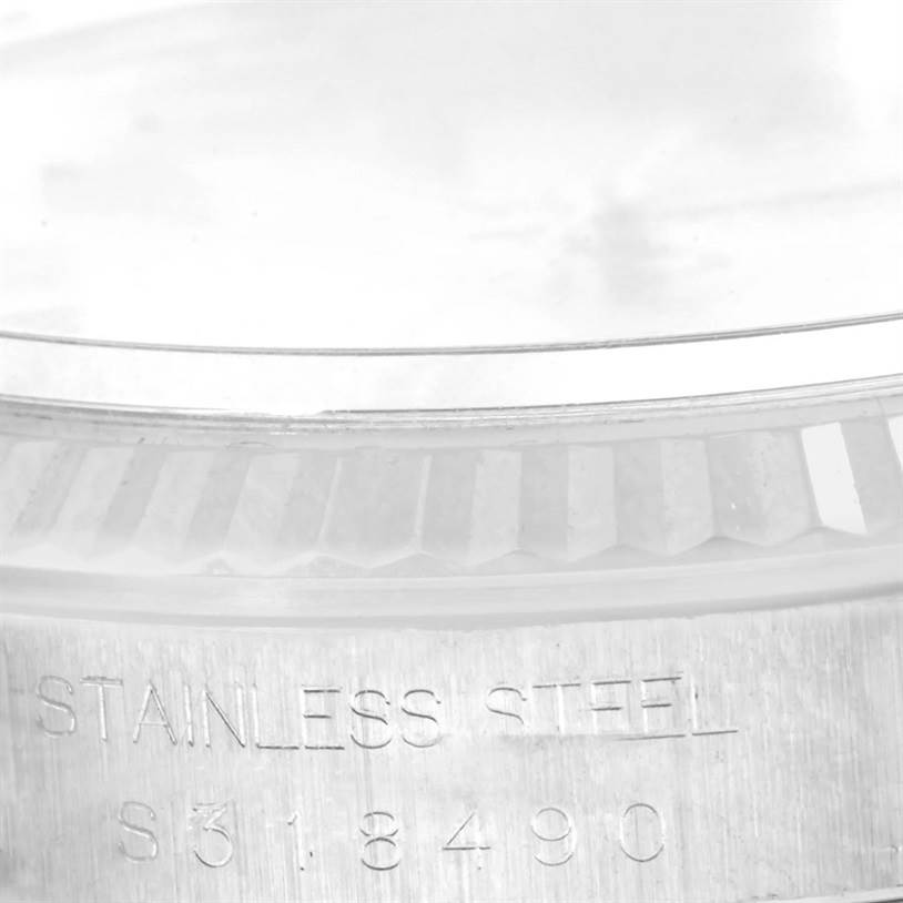 This image shows a close-up angled view of the bezel engraving and model number on a Rolex Datejust 16234 Men's Stainless Steel Silver Dial 16234 Men's Stainless Steel Silver Dial stainless steel watch.