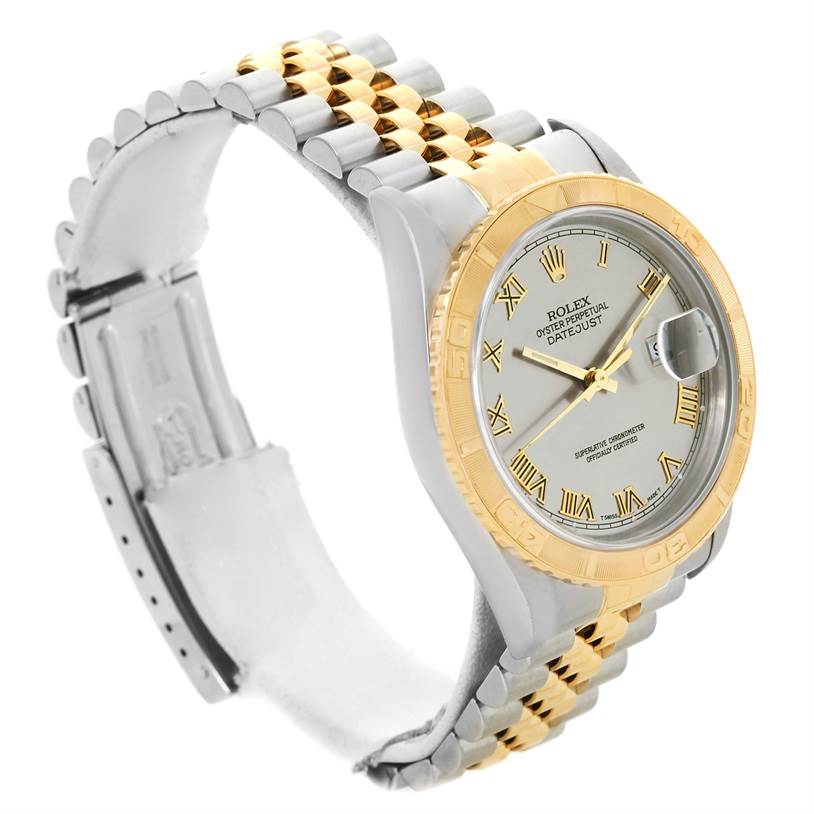 The Rolex Datejust 16263 Men's Steel and Gold (two tone) Grey Dial 16263 Men's Steel and Gold (two tone) Grey Dial watch is shown at a three-quarter angle, highlighting the dial, bezel, and two-tone bracelet.