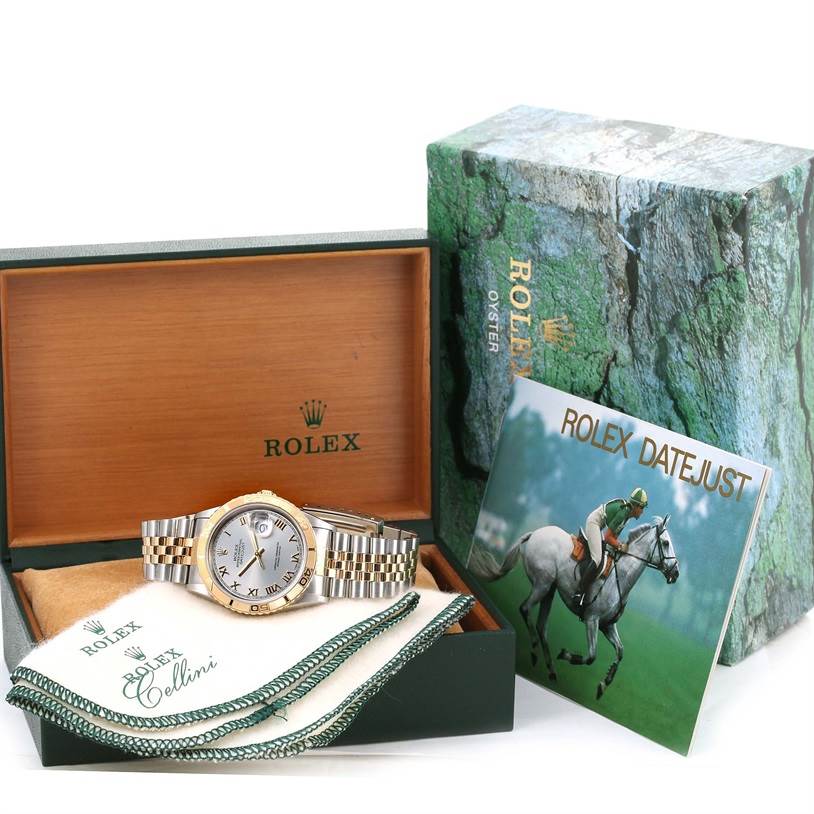 The Rolex Datejust 16263 Men's Steel and Gold (two tone) Grey Dial 16263 Men's Steel and Gold (two tone) Grey Dial watch is shown with its case, booklet, and cleaning cloth, viewed from the front.