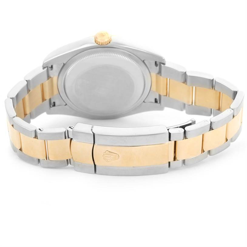 The image shows the back view of a Rolex Datejust 116233 Men
s Stainless Steel Black Dial 116233 Men
s Stainless Steel Black Dial, highlighting its bi-metal bracelet and clasp.