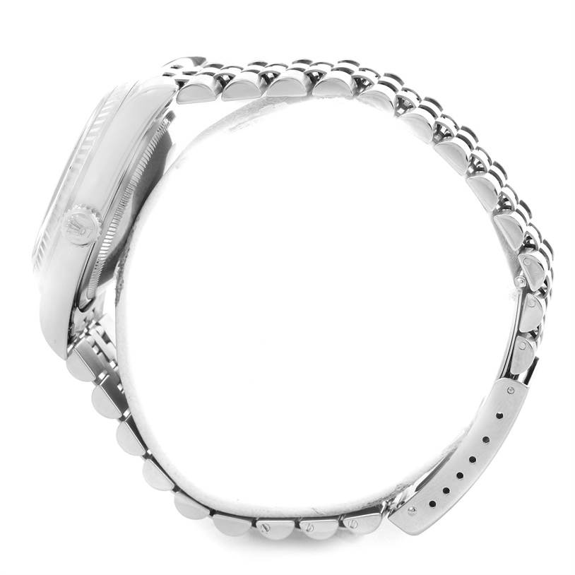 The image shows a Rolex Datejust 16234 Men
s Stainless Steel Silver Dial 16234 Men
s Stainless Steel Silver Dial watch from a side angle, highlighting the case, crown, and partial bracelet.