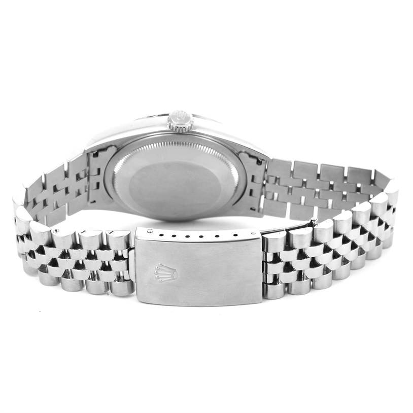 This image shows the back of a Rolex Datejust 16234 Men
s Stainless Steel Silver Dial 16234 Men
s Stainless Steel Silver Dial watch, showcasing the case back and metal bracelet with the clasp open.