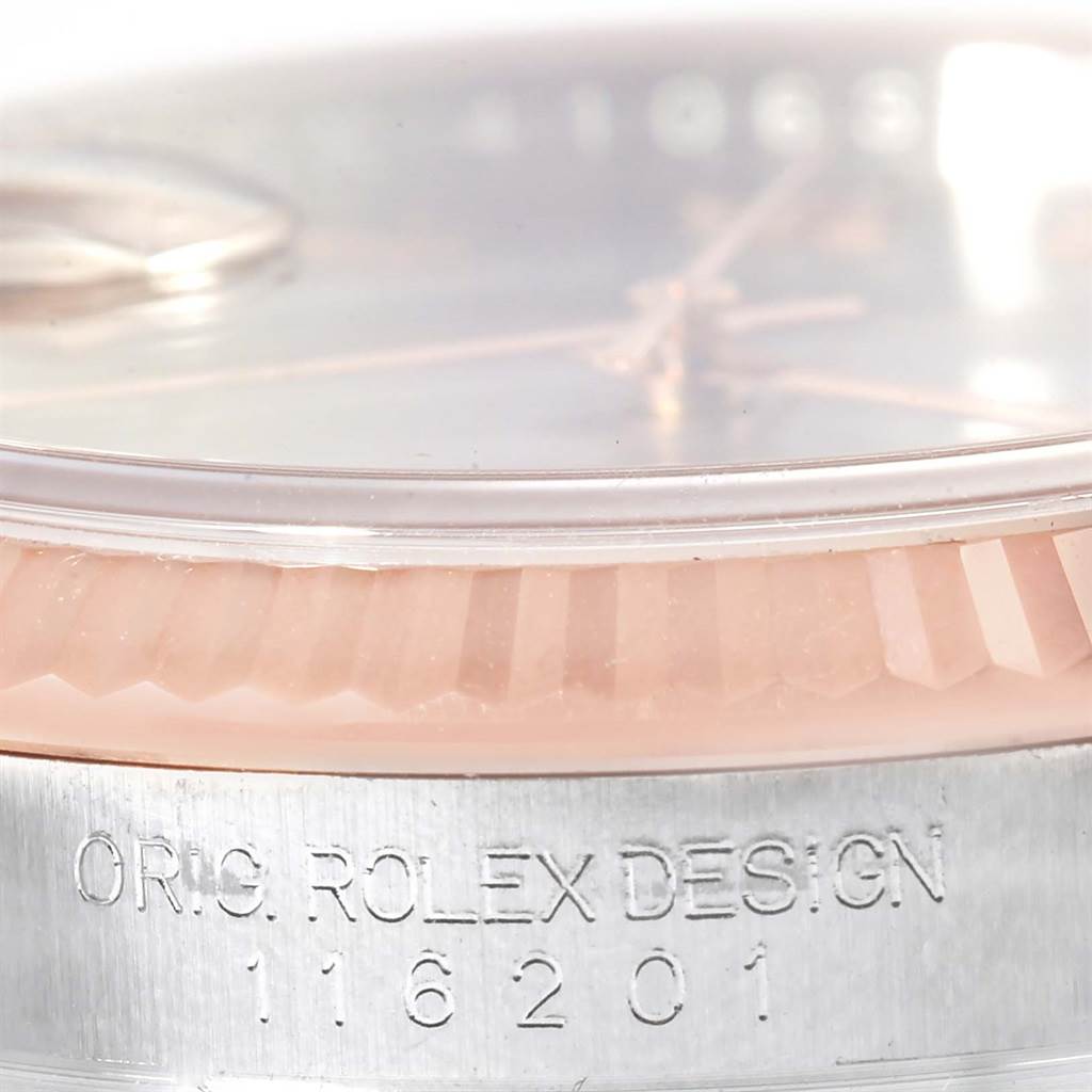 The image shows a close-up view of the Rolex Datejust 116201 Men
s Steel and Gold (two tone) Grey Dial 116201 Men
s Steel and Gold (two tone) Grey Dial watch
s bezel and case, displaying its model number engraved.