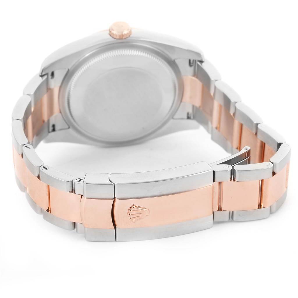 The image shows the back view of a Rolex Datejust 116201 Men
s Steel and Gold (two tone) Grey Dial 116201 Men
s Steel and Gold (two tone) Grey Dial, highlighting its case back, crown, and two-tone bracelet with clasp.