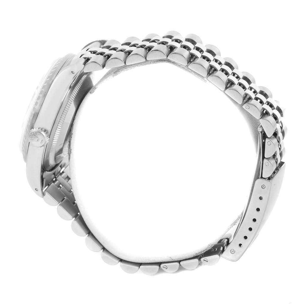 The image shows a side view of the Rolex Datejust 16220 Men
s Stainless Steel Silver Dial 16220 Men
s Stainless Steel Silver Dial watch, highlighting the case, crown, and bracelet.