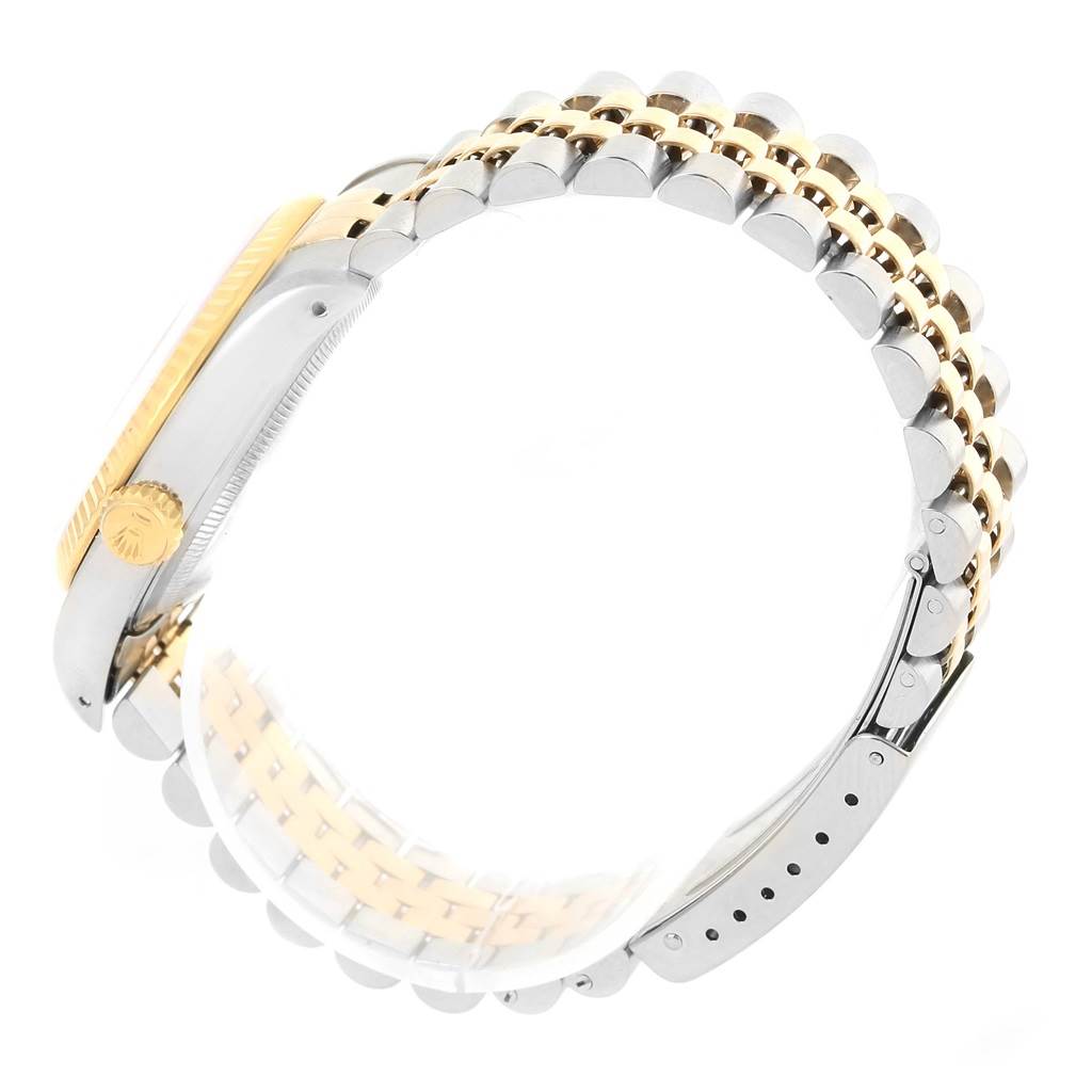 This image shows a side view of a Rolex Datejust 16233 Men's Steel and Gold (two tone) White Dial 16233 Men's Steel and Gold (two tone) White Dial watch, focusing on the crown and Jubilee bracelet.