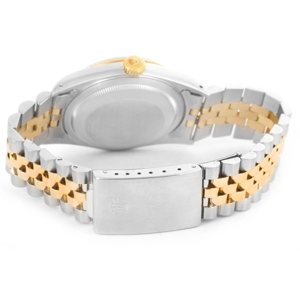 The image shows the back of a Rolex Datejust 16233 Men's Steel and Gold (two tone) White Dial 16233 Men's Steel and Gold (two tone) White Dial watch, highlighting its stainless steel and gold Jubilee bracelet and clasp.