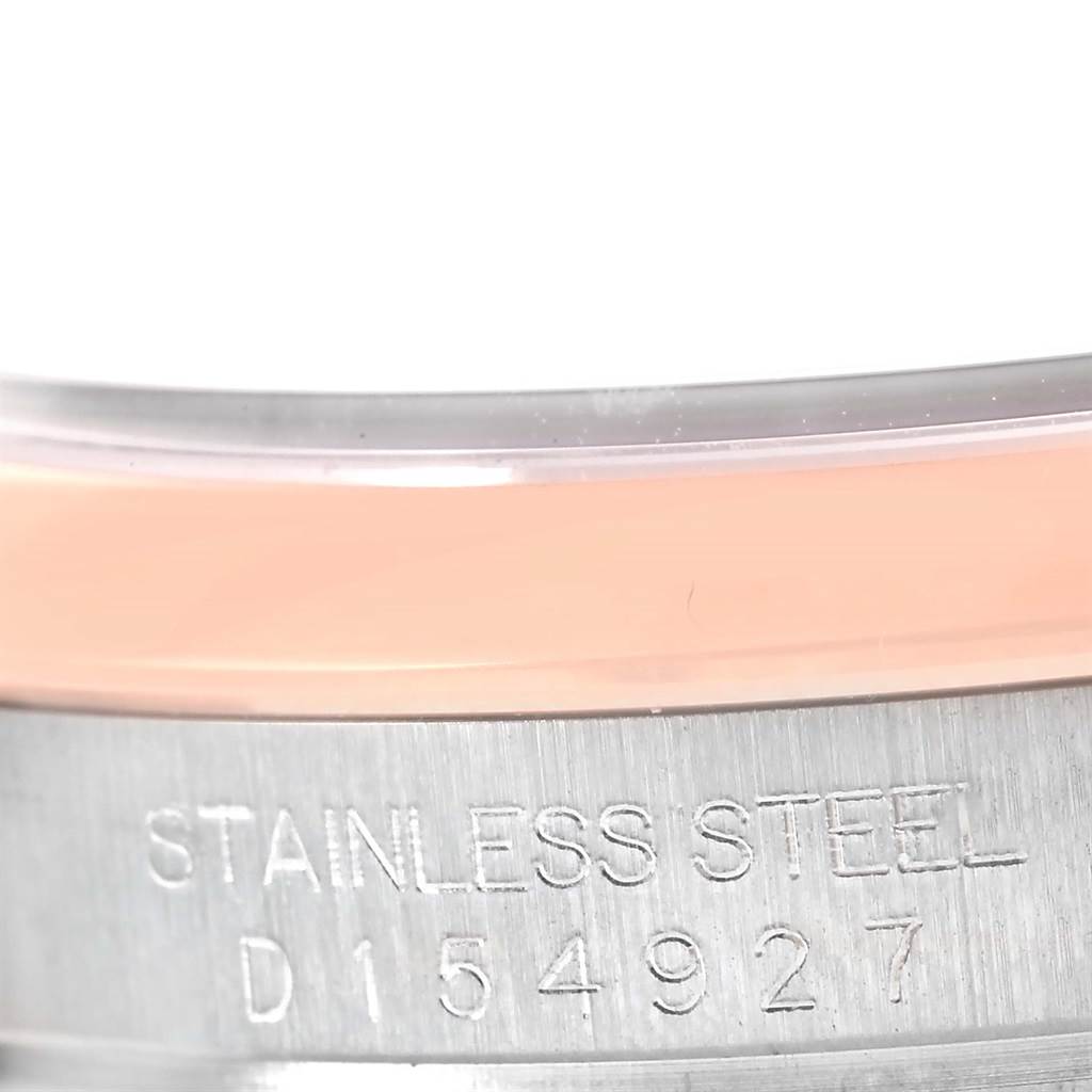 The image shows a close-up of the serial number and "STAINLESS STEEL" engraving on the case of a Rolex Datejust 116201 Steel and Gold (two tone) Black Dial 116201 Steel and Gold (two tone) Black Dial watch.