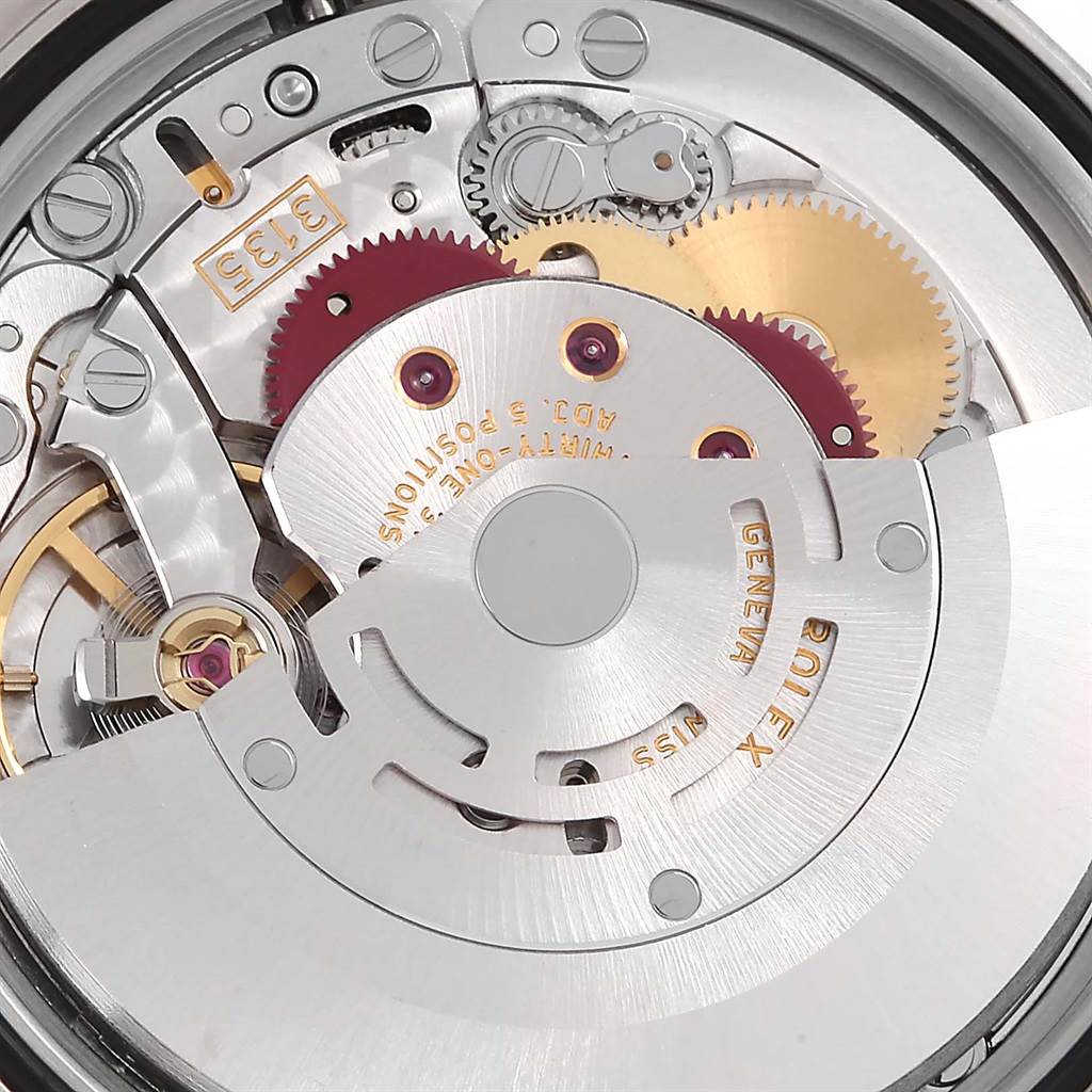 This image shows a close-up view of the intricate movement mechanism inside a Rolex Datejust 116201 Steel and Gold (two tone) Black Dial 116201 Steel and Gold (two tone) Black Dial watch.