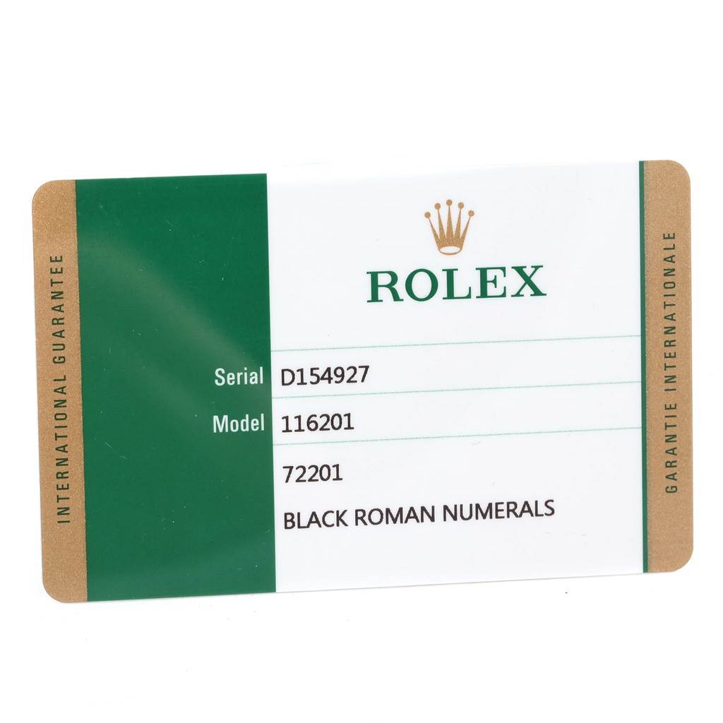The image shows an angled view of a Rolex warranty card for the Datejust model with model number 116201 and serial number D154927.