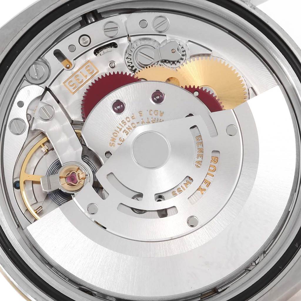 The image shows the intricate internal mechanism of a Rolex Datejust 116233 Men's Stainless Steel Champagne Dial 116233 Men's Stainless Steel Champagne Dial watch viewed from the back.