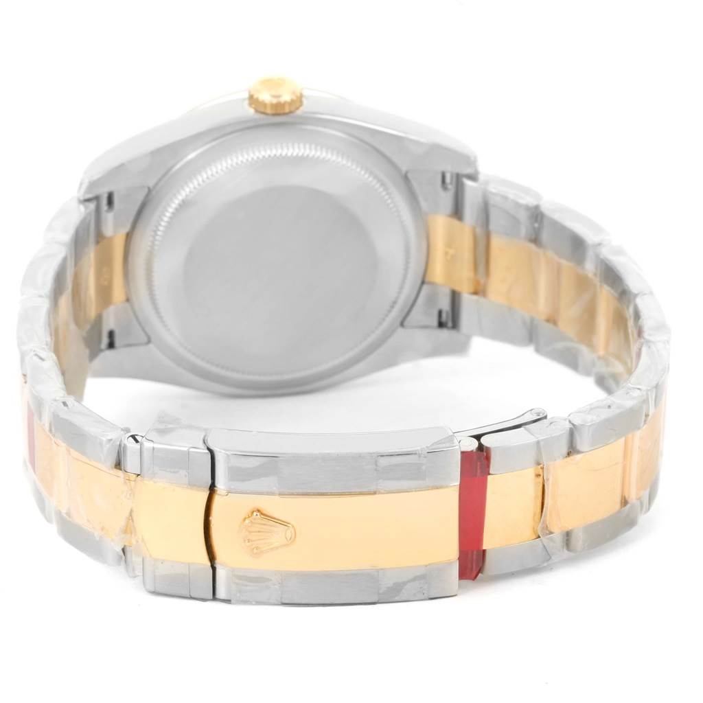 The image shows the back view of a Rolex Datejust 116233 Men
s Stainless Steel Brown Dial 116233 Men
s Stainless Steel Brown Dial watch, highlighting its two-tone bracelet and case back.