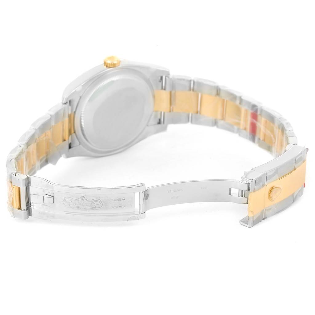 The image shows a Rolex Datejust 116233 Men
s Stainless Steel Brown Dial 116233 Men
s Stainless Steel Brown Dial watch from the back, highlighting the two-tone bracelet and open clasp.