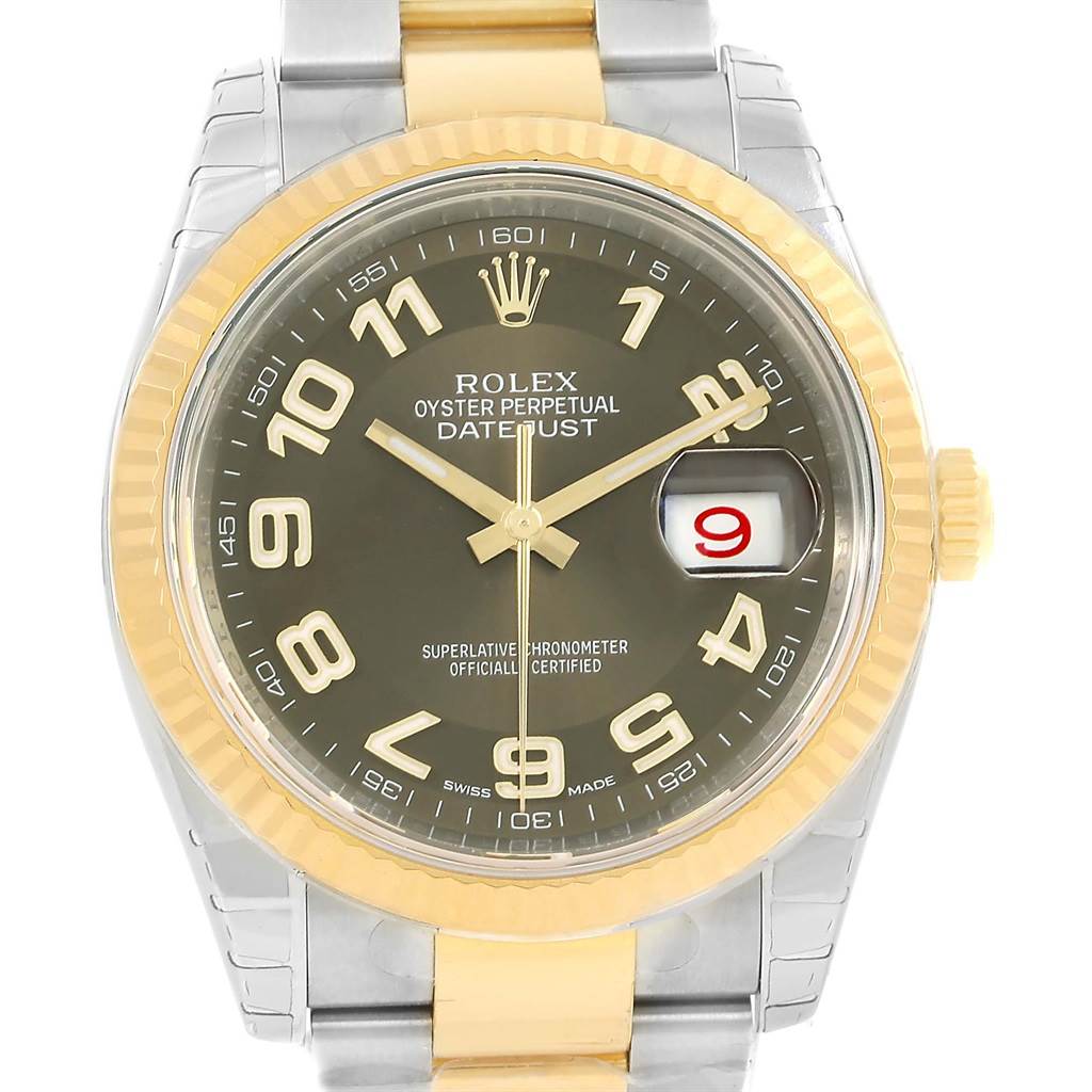 The Rolex Datejust 116233 Men
s Stainless Steel Brown Dial 116233 Men
s Stainless Steel Brown Dial watch is shown from the front, displaying its dial, hands, and date window, along with a two-tone bezel and bracelet.