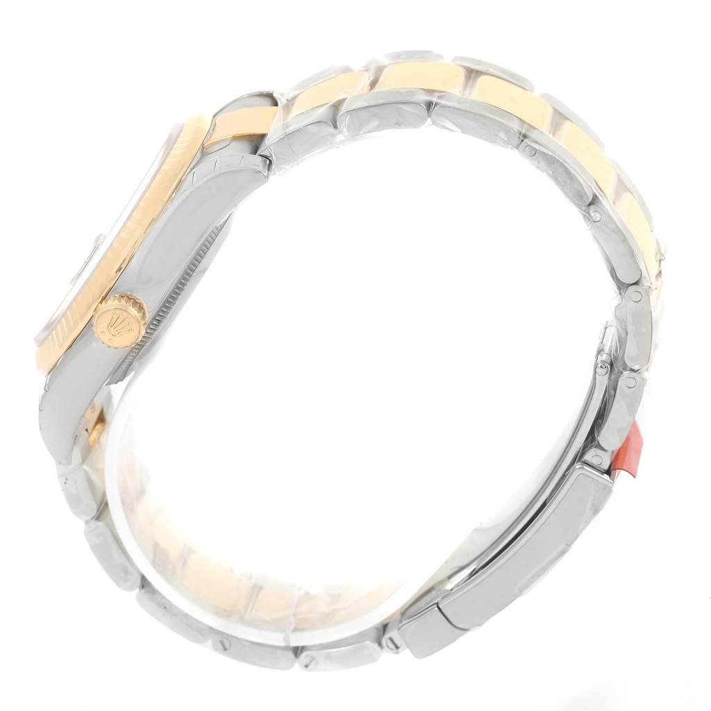 The image shows the side view of a Rolex Datejust 116233 Men's Stainless Steel Green Dial 116233 Men's Stainless Steel Green Dial watch, highlighting the crown and part of the bracelet.