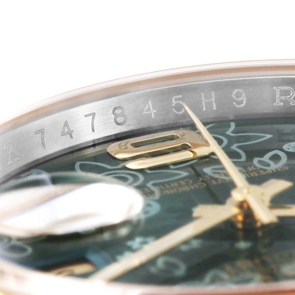 The image shows a close-up angle of the dial and serial number of a Rolex Datejust 116233 Men's Stainless Steel Green Dial 116233 Men's Stainless Steel Green Dial watch.
