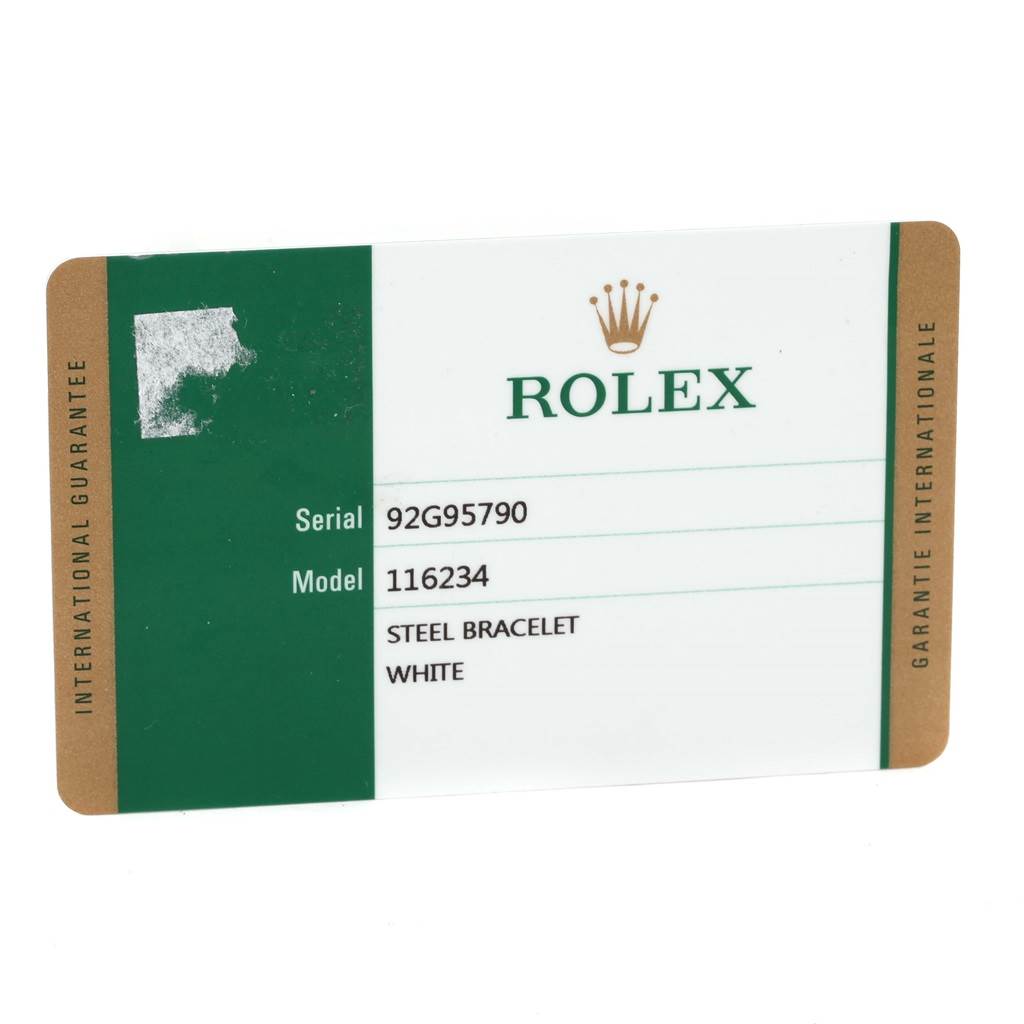 This image shows a warranty card for a Rolex Datejust 116234 Men
s Stainless Steel Blue Dial 116234 Men
s Stainless Steel Blue Dial model, detailing serial number, model number, and bracelet type.