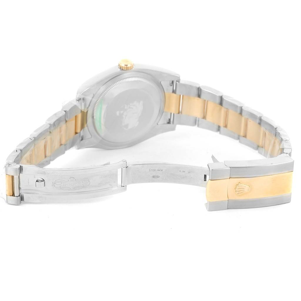 The image shows the back and open clasp of a Rolex Datejust 116233 Men
s Stainless Steel Black Dial 116233 Men
s Stainless Steel Black Dial, highlighting its two-tone metal bracelet.