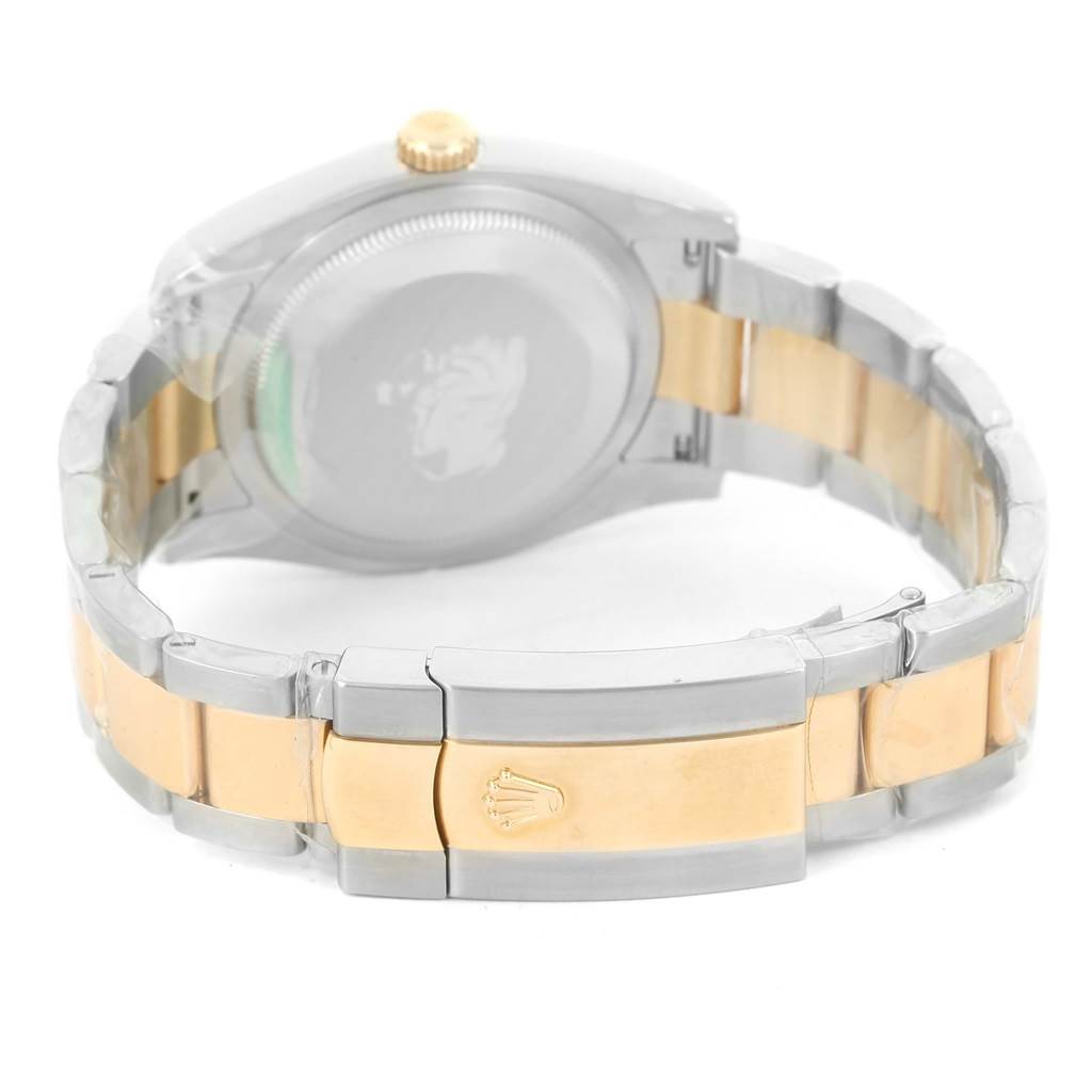 The image shows the back view of the Rolex Datejust 116233 Men
s Stainless Steel Black Dial 116233 Men
s Stainless Steel Black Dial watch, highlighting its two-tone bracelet and clasp with the brand
s logo.