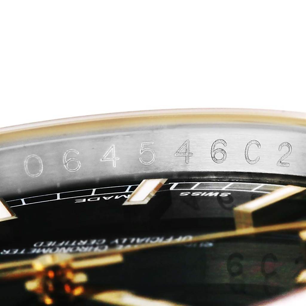 This image shows a close-up angle of the serial number inscribed on the inner bezel of a Rolex Datejust 116233 Men
s Stainless Steel Black Dial 116233 Men
s Stainless Steel Black Dial watch.
