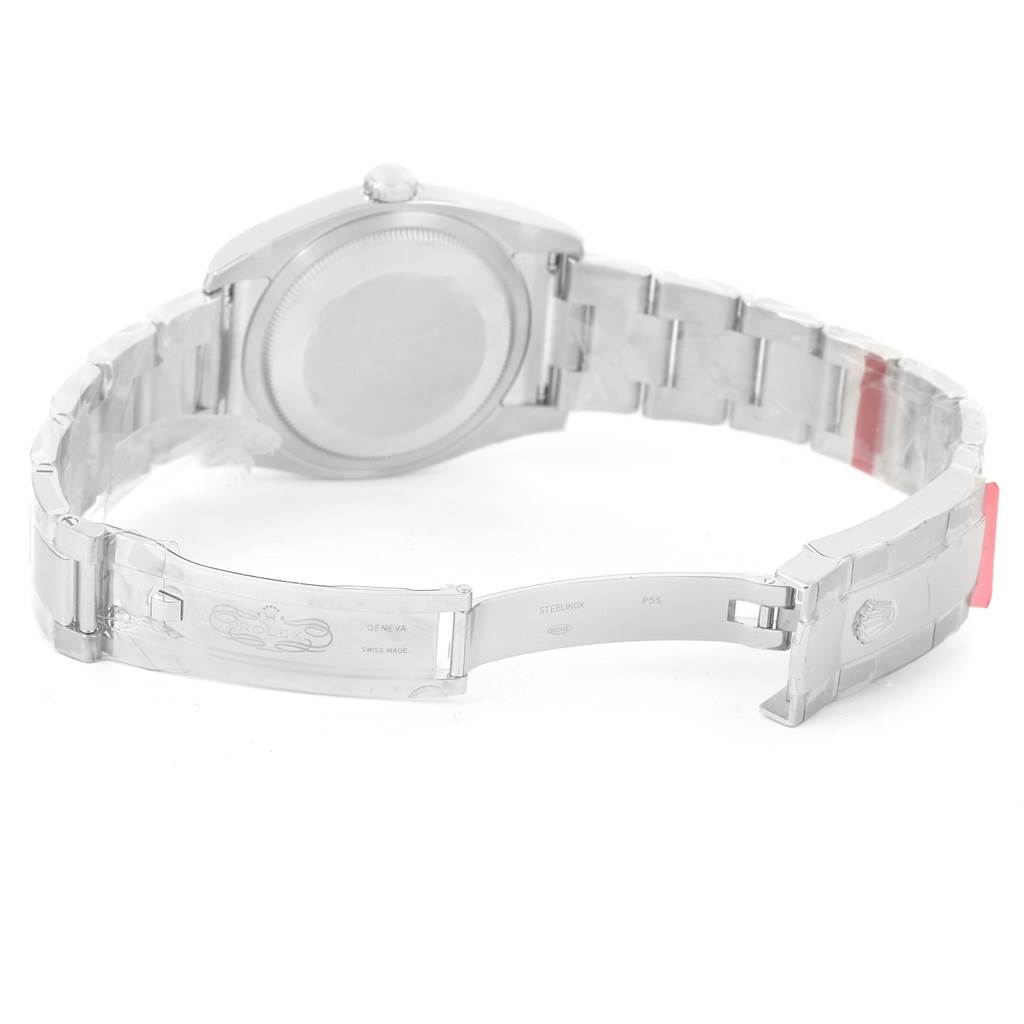 The image shows the backside and partially open clasp of a Rolex Datejust 116234 Men
s Stainless Steel White Dial 116234 Men
s Stainless Steel White Dial watch.