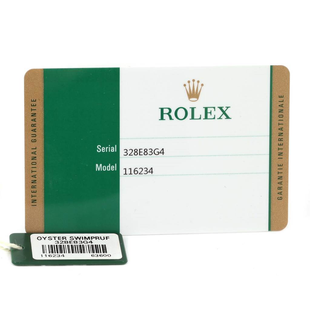 This image shows the international guarantee card and tag for a Rolex Datejust 116234 Men
s Stainless Steel White Dial 116234 Men
s Stainless Steel White Dial model 116234 watch.