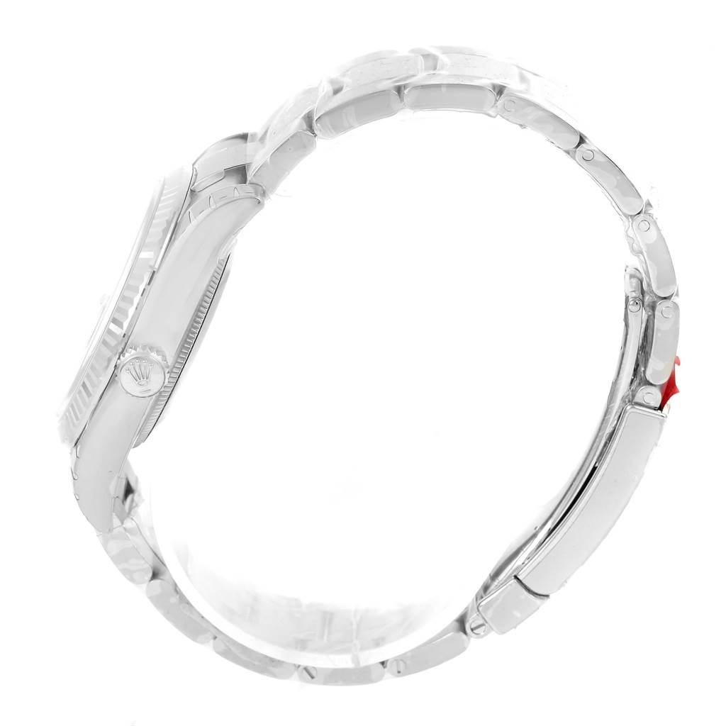 The image shows a side view of a Rolex Datejust 116234 Men
s Stainless Steel Silver Dial 116234 Men
s Stainless Steel Silver Dial watch, highlighting the crown, case, and part of the bracelet.