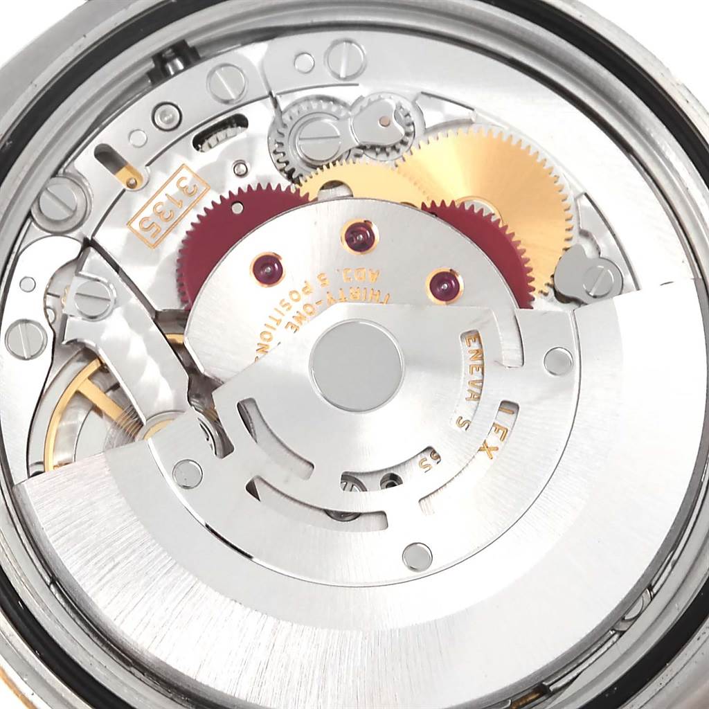 This image shows a close-up of the movement mechanism inside a Rolex Datejust 116233 Men's Stainless Steel White Dial 116233 Men's Stainless Steel White Dial watch, highlighting gears and components.