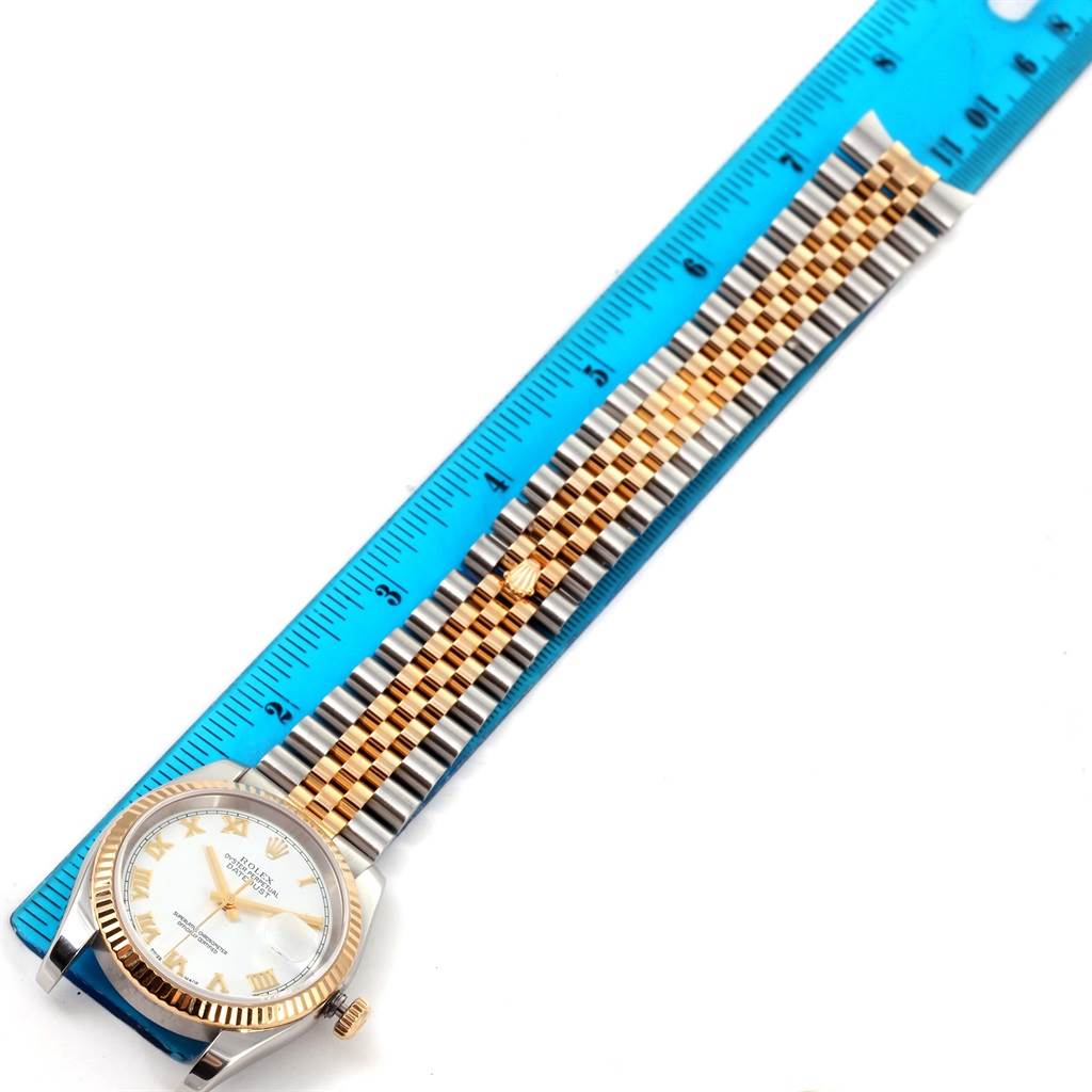 The watch is a Rolex Datejust 116233 Men's Stainless Steel White Dial 116233 Men's Stainless Steel White Dial model, shown from a top-down angle with a full view of the dial and bracelet alongside a ruler.