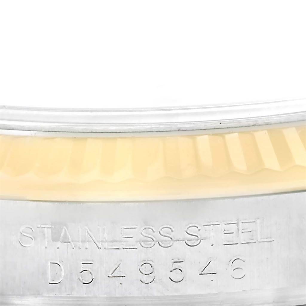 This close-up image shows the serial number and stainless steel engraving on the side of the Rolex Datejust 116233 Men's Stainless Steel White Dial 116233 Men's Stainless Steel White Dial watch case.