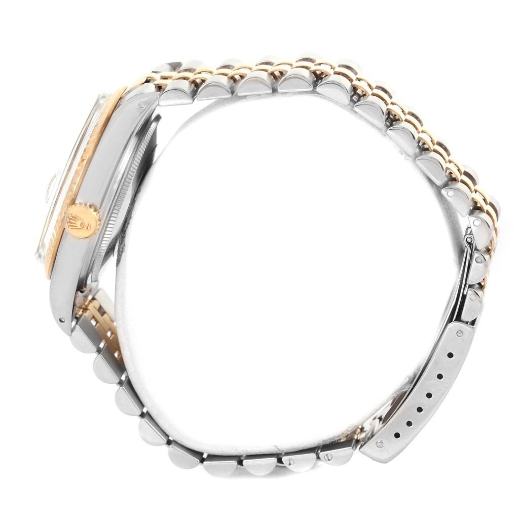 This image shows a side view of the Rolex Datejust 16013 Men
s Stainless Steel Champagne Dial 16013 Men
s Stainless Steel Champagne Dial watch, highlighting its crown, case, and Jubilee bracelet.