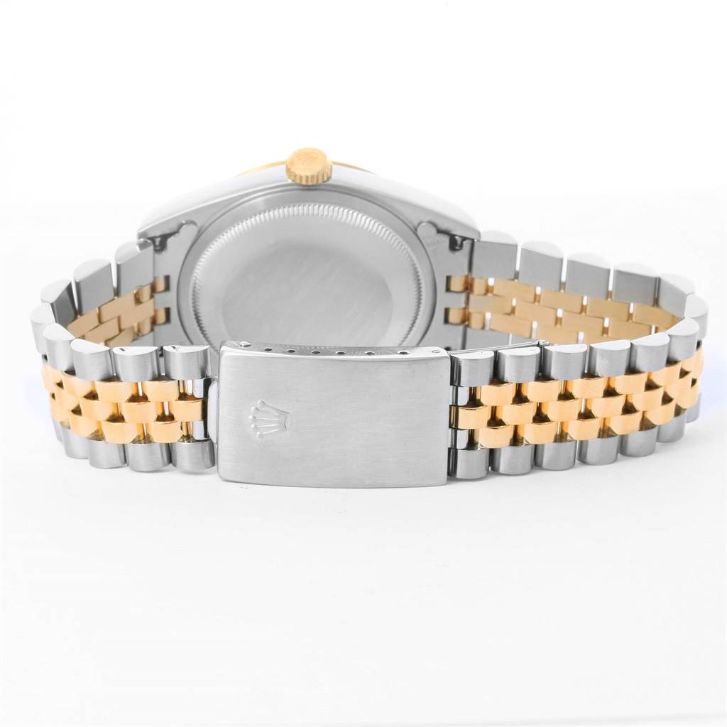 The image shows the back view of a Rolex Datejust 16233 Men's Steel and Gold (two tone) Champagne Dial 16233 Men's Steel and Gold (two tone) Champagne Dial watch with its Jubilee bracelet and clasp.