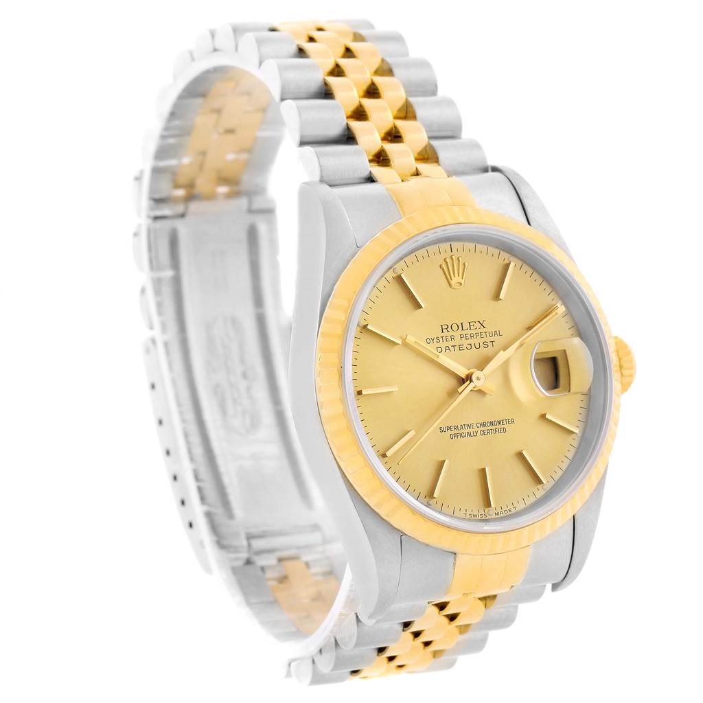 This image shows a Rolex Datejust 16233 Men's Steel and Gold (two tone) Champagne Dial 16233 Men's Steel and Gold (two tone) Champagne Dial watch at an oblique angle, highlighting its face, bezel, crown, and partially the jubilee bracelet.