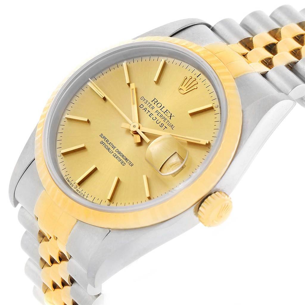 The image shows a Rolex Datejust 16233 Men's Steel and Gold (two tone) Champagne Dial 16233 Men's Steel and Gold (two tone) Champagne Dial watch at a three-quarter angle, highlighting its gold dial, fluted bezel, and two-tone jubilee bracelet.