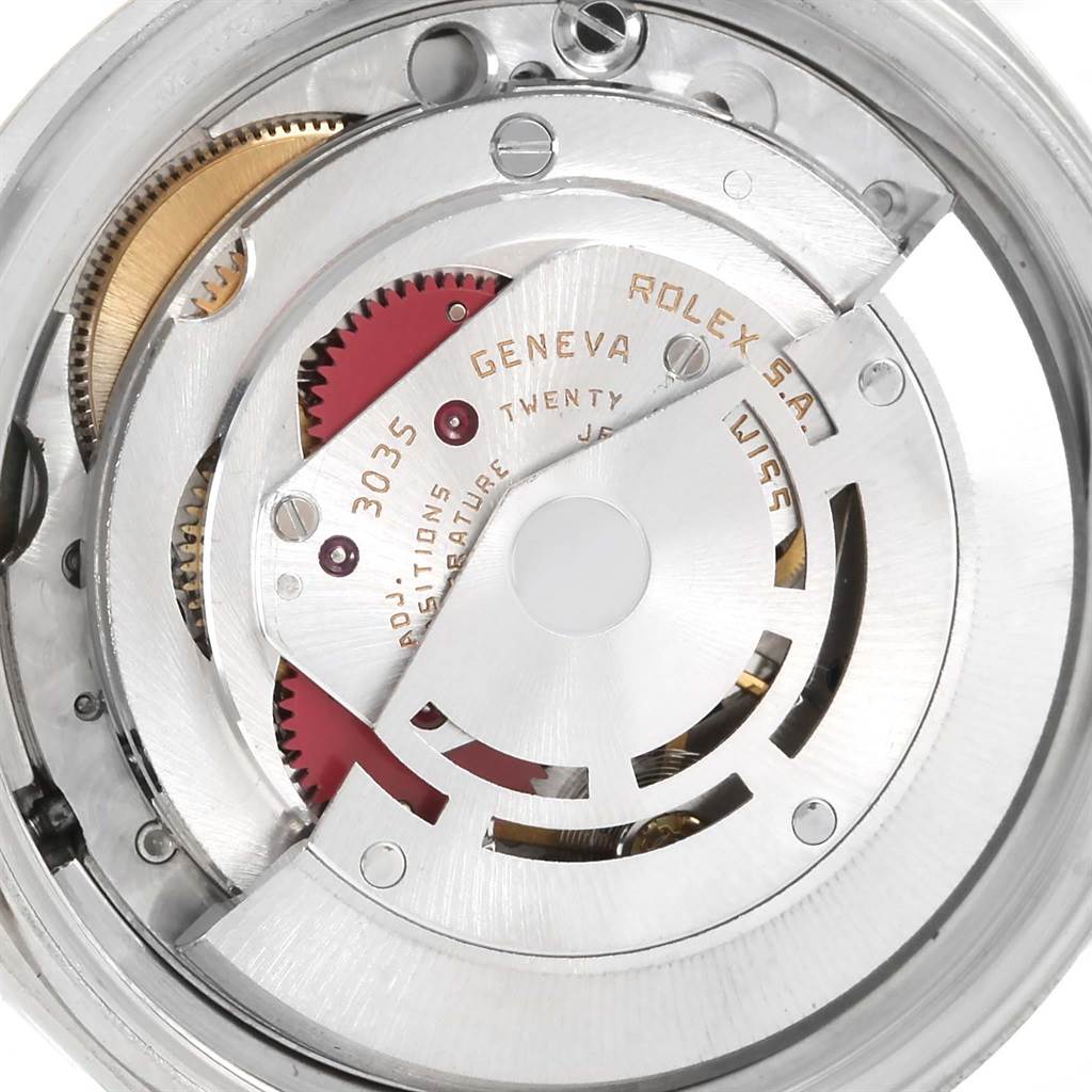 This image shows the internal mechanical movement of a Rolex Datejust 16013 Stainless Steel Champagne Dial 16013 Stainless Steel Champagne Dial watch, focusing on its intricate gears and components.