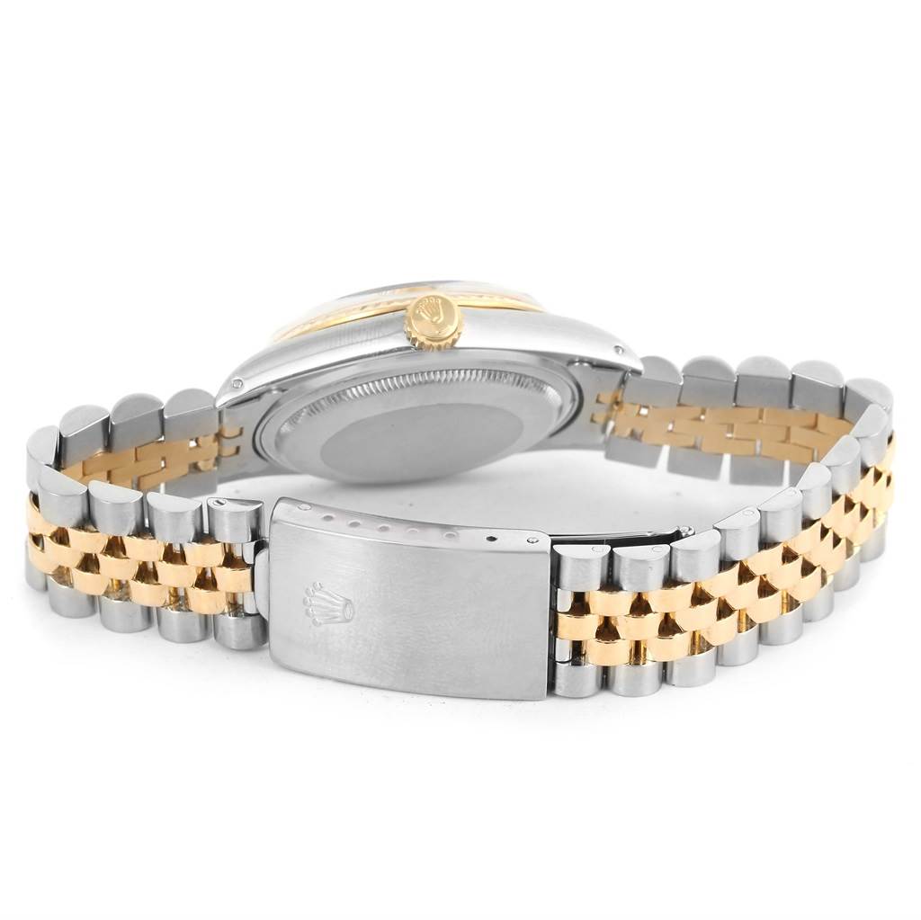 The image shows the back view of a Rolex Datejust 16013 Stainless Steel Champagne Dial 16013 Stainless Steel Champagne Dial watch, highlighting the bi-metallic bracelet and clasp.