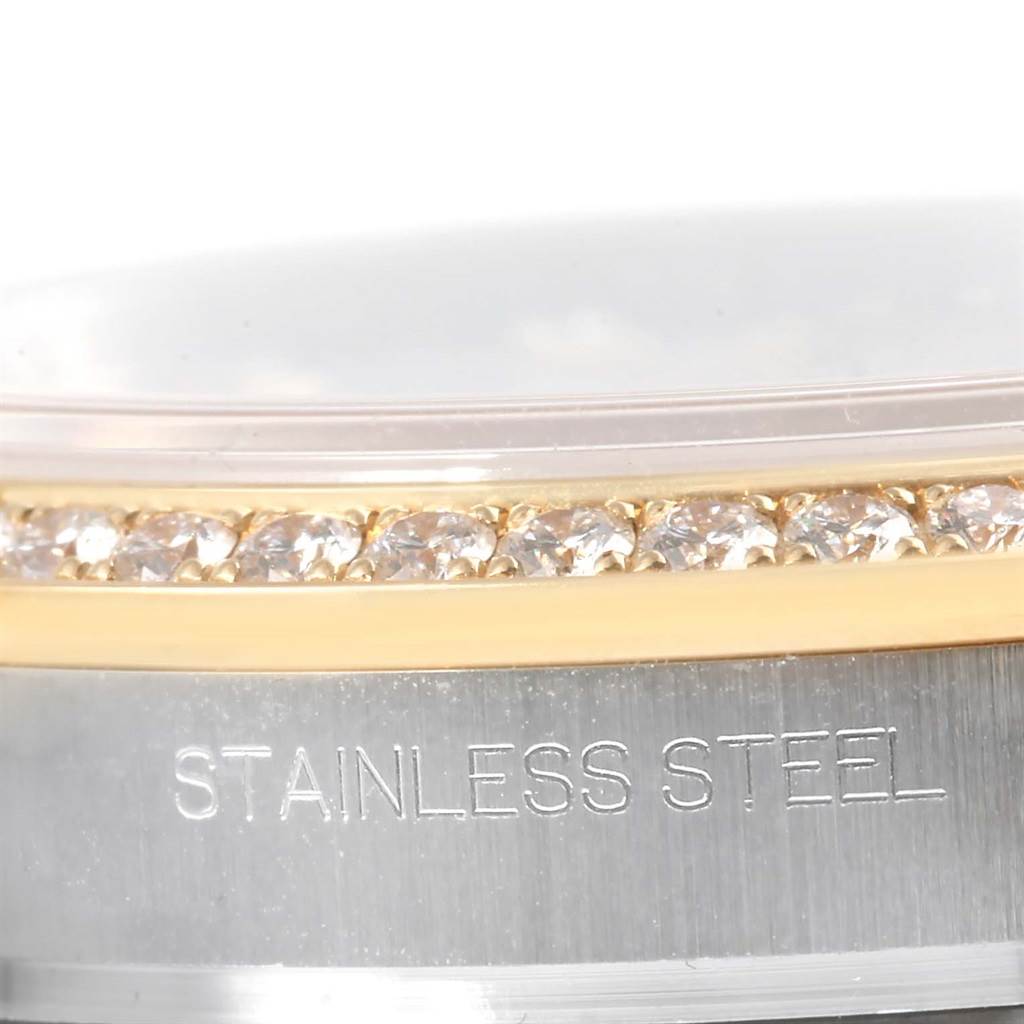 This close-up image shows the bezel and part of the band of a Rolex Datejust 116243 Men's Stainless Steel Mother of Pearl Dial 116243 Men's Stainless Steel Mother of Pearl Dial watch, highlighting its stainless steel and diamond details.