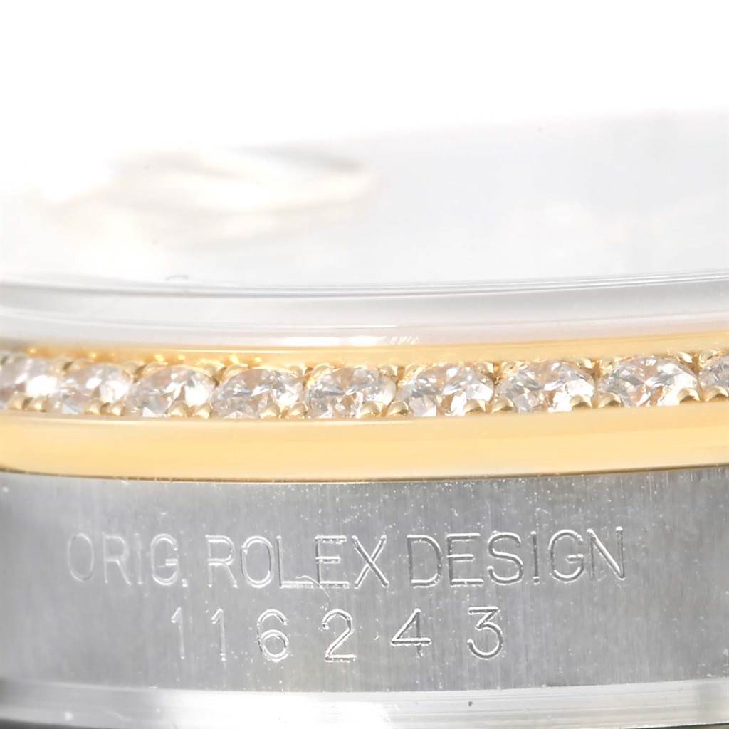 The image shows a close-up side view of the bezel, case, and serial number engraving of the Rolex Datejust 116243 Men's Stainless Steel Mother of Pearl Dial 116243 Men's Stainless Steel Mother of Pearl Dial model.