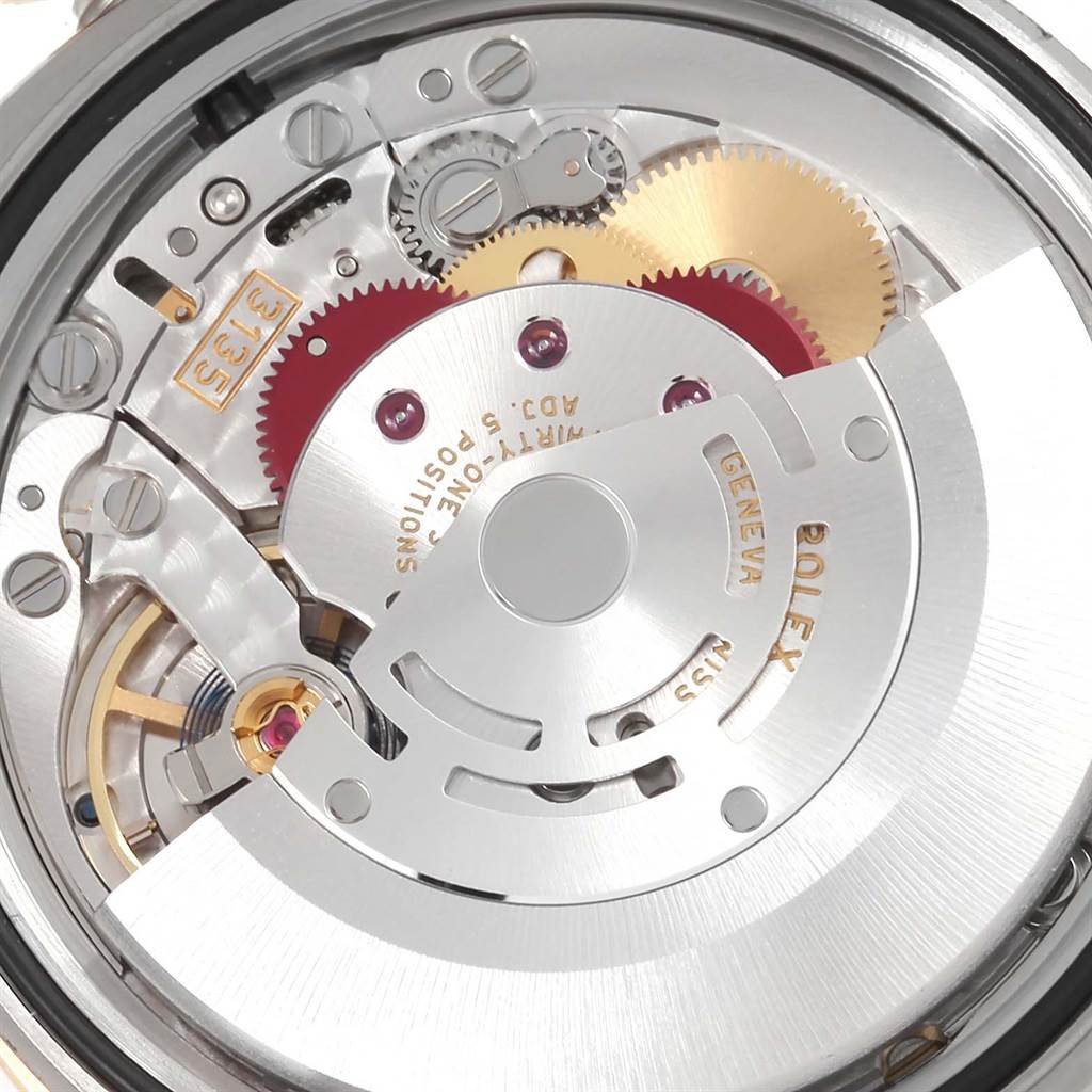 This image shows the intricate mechanical movement of a Rolex Datejust 116243 Men's Stainless Steel Mother of Pearl Dial 116243 Men's Stainless Steel Mother of Pearl Dial watch from a close-up, internal angle.