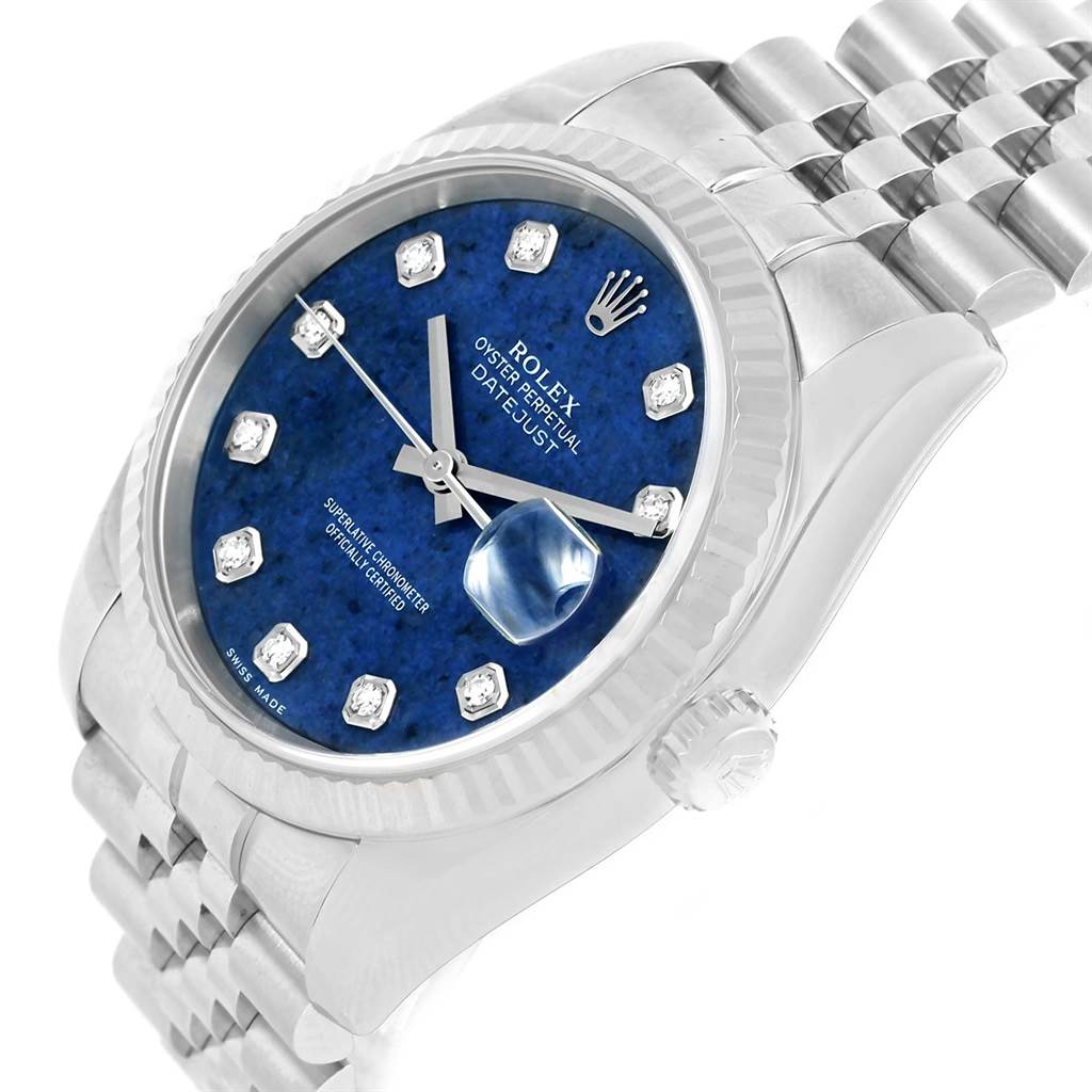 The image shows a close-up angle of a Rolex Datejust 116234 Men's Stainless Steel Blue Dial 116234 Men's Stainless Steel Blue Dial watch, highlighting its blue dial, fluted bezel, and Jubilee bracelet.
