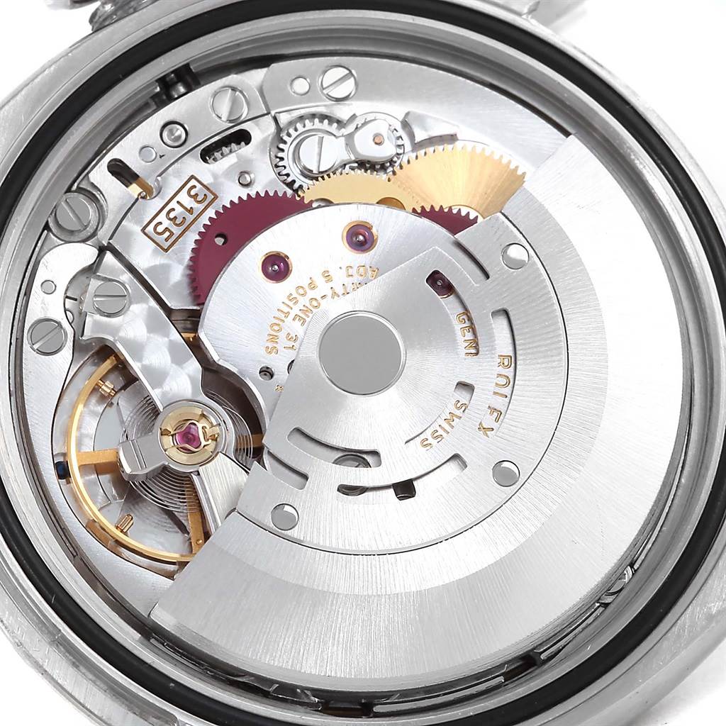 The image shows an internal view of the Rolex Datejust 116234 Men's Stainless Steel Blue Dial 116234 Men's Stainless Steel Blue Dial model's movement and gears.